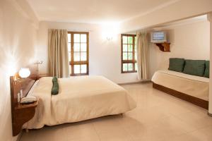 Cama ou camas em um quarto em Hotel Princess