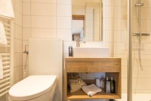 a bathroom with a sink and a toilet at Posthorn in Ühlingen-Birkendorf