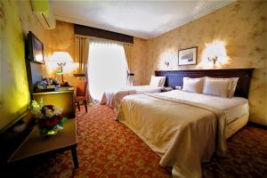 Cama o camas de una habitación en Pera Rose Hotel