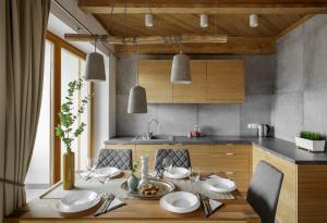 Kuchyňa alebo kuchynka v ubytovaní udanypobyt Apartamenty Tuwima