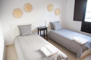 Giường trong phòng chung tại Caleton Alhambra +34 ảnh