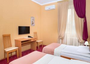 Postel nebo postele na pokoji v ubytování Shine Hotel