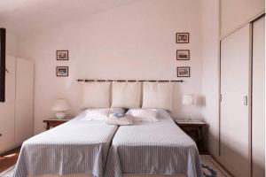 Ένα ή περισσότερα κρεβάτια σε δωμάτιο στο Bilocale Ginestre - Costa Smeralda