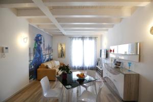 a living room with a table and a couch at Venice Loft in Marghera