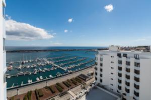a view of a marina with boats in the water at Apartment Sol Mar in Ponta Delgada