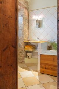 a bathroom with a sink and a mirror at Topaze in Monnières