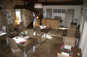 an overhead view of a restaurant with tables and chairs at Le Colombier Bretagne in Louannec