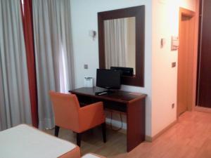 TV a/nebo společenská místnost v ubytování Hotel Alfageme
