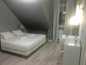 Posteľ alebo postele v izbe v ubytovaní Grota Bochotnicka