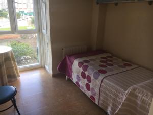 Postel nebo postele na pokoji v ubytování Hotel Azcona