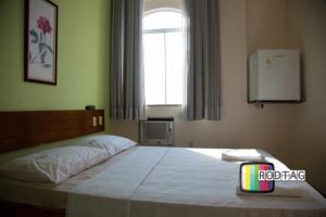 Postel nebo postele na pokoji v ubytování Hotel Porto Da Barra