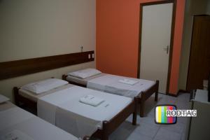 Postel nebo postele na pokoji v ubytování Hotel Porto Da Barra