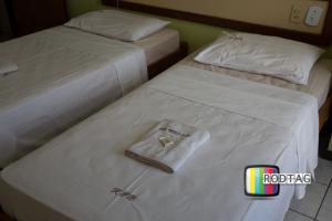 Postel nebo postele na pokoji v ubytování Hotel Porto Da Barra