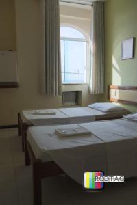 Postel nebo postele na pokoji v ubytování Hotel Porto Da Barra