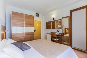 Postel nebo postele na pokoji v ubytování Hotel Aldebaran