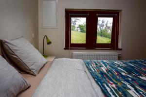 Postel nebo postele na pokoji v ubytování B&B Ferme de Leuze Rustieke Gîtes nabij Durbuy, eigen laadpalen