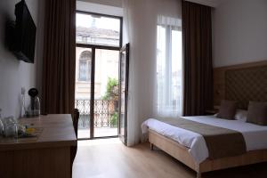 Postel nebo postele na pokoji v ubytování Hotel Varios