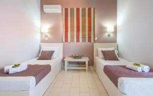 Posteľ alebo postele v izbe v ubytovaní Blue House Apartments
