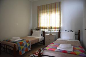 Posteľ alebo postele v izbe v ubytovaní Dimitris' & Valentina's Home
