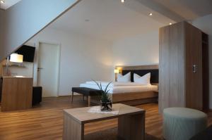 Postel nebo postele na pokoji v ubytování Flair Hotel Grüner Baum