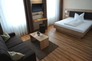 Postel nebo postele na pokoji v ubytování Flair Hotel Grüner Baum