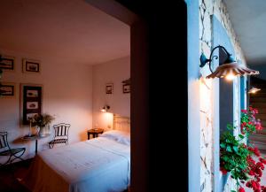En eller flere senge i et værelse på Masseria La Chiusa Delle More