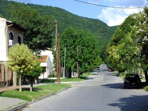 a street in a small town with a mountain at La Casa de Mia Mama in Salta