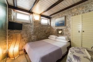 Postel nebo postele na pokoji v ubytování Guesthouse Mirula