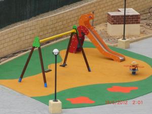 a childrens playground with a slide and a slideintend at Apartamentos Finestrat I-II in Cala de Finestrat
