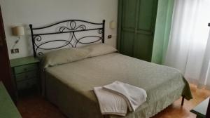 Postel nebo postele na pokoji v ubytování Hotel La Mimosa