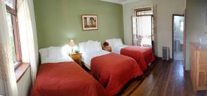 Ένα ή περισσότερα κρεβάτια σε δωμάτιο στο Centro Vacacional Huaychulo