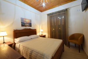 A bed or beds in a room at Driopes Villas