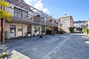 an empty courtyard of a building with a balcony at Fremantle Townhouse Unit 4 in Fremantle