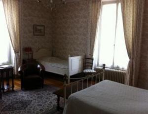 Postel nebo postele na pokoji v ubytování Château des Bouffards + 29 fotografií