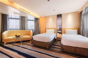 Katil atau katil-katil dalam bilik di Metropark Hotel Mongkok