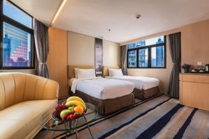 Katil atau katil-katil dalam bilik di Metropark Hotel Mongkok