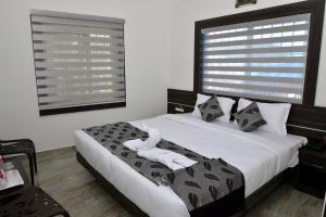 מיטה או מיטות בחדר ב-Suroor Tourist Home
