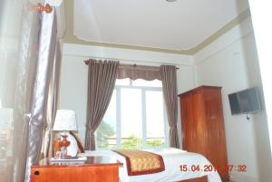 מיטה או מיטות בחדר ב-Paradise Hotel