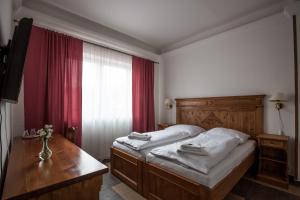 Posteľ alebo postele v izbe v ubytovaní Apartmány LAGUNA