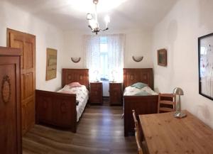 Posteľ alebo postele v izbe v ubytovaní Apartmány U sv. Floriána