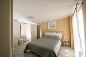 Un pat sau paturi într-o cameră la La Fiorana Ivrea