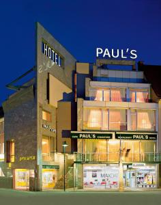 a building with a hotel on the side of it at Paul's Hotel in Knittelfeld