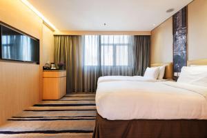 Katil atau katil-katil dalam bilik di Metropark Hotel Mongkok