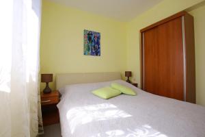 Ein Bett oder Betten in einem Zimmer der Unterkunft Apartment Zubčić
