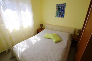 Ein Bett oder Betten in einem Zimmer der Unterkunft Apartment Zubčić