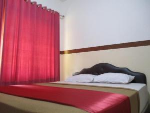 Voodi või voodid majutusasutuse Hotel Tugu Asri toas