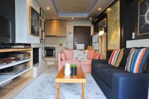 a living room with a couch and a table at Agrinio ART Suites in Agrinio