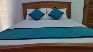 Letto o letti in una camera di Sunhill Lake Tourist Rest