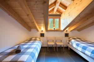 Ein Bett oder Betten in einem Zimmer der Unterkunft Ski and bike - holiday home Verbier Valley