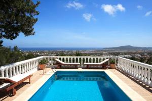 a swimming pool on the balcony of a house at Can Carlos Ibiza in Sant Jordi